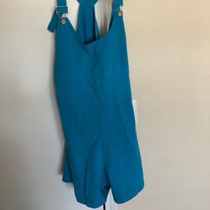 Blue overall shorts.